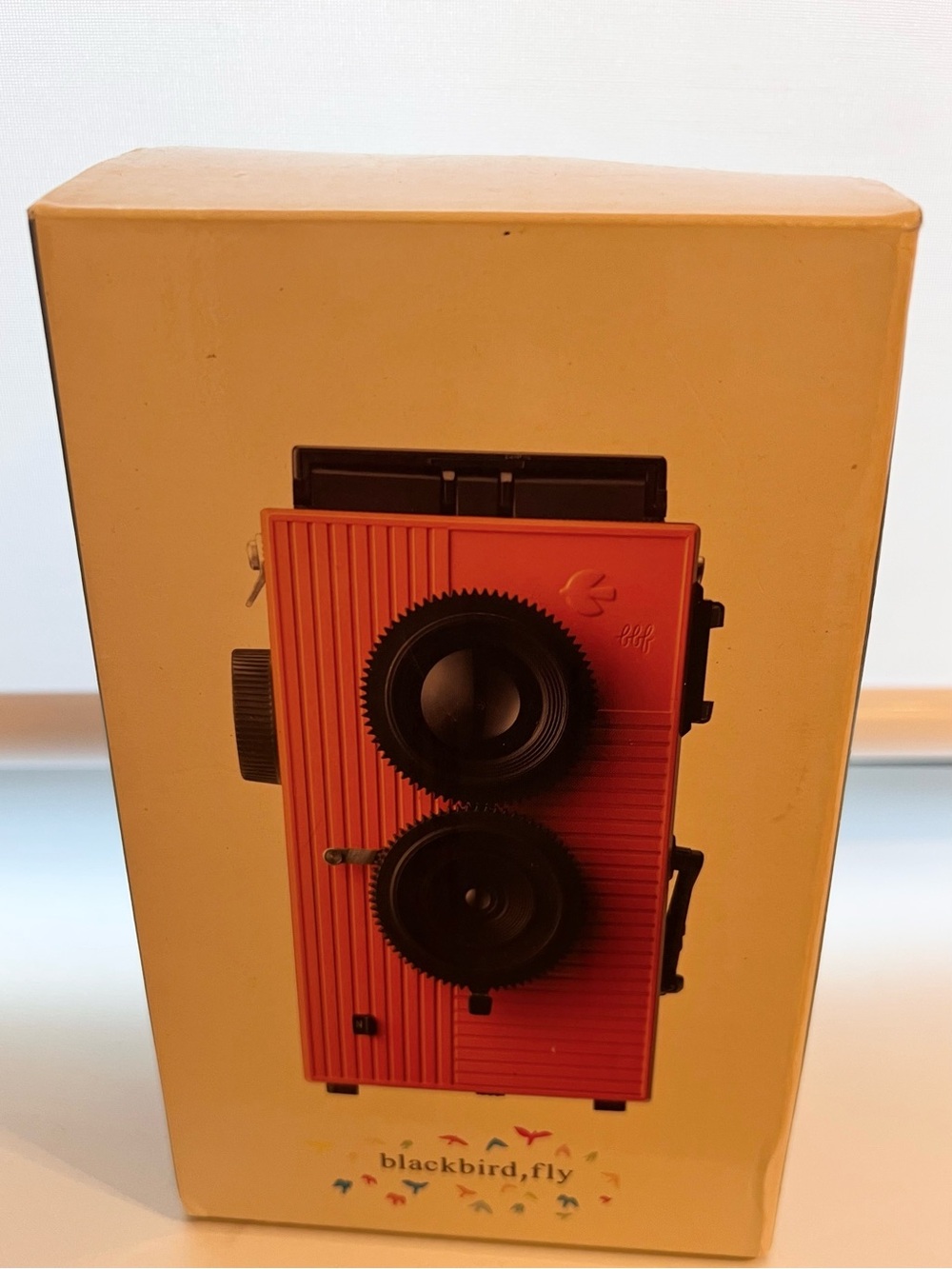 Red Twin-Lens Camera Blackbird, fly